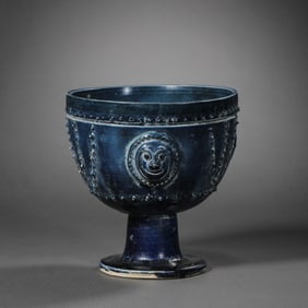 Chinese Sui Dynasty blue glaze cup with drum nail pattern