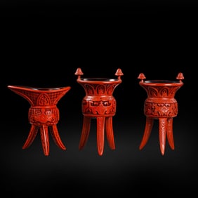 A set of Chinese Qing Dynasty carved red cups