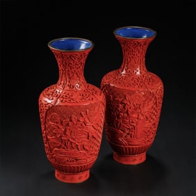 A pair of Chinese Qing Dynasty carved red vases