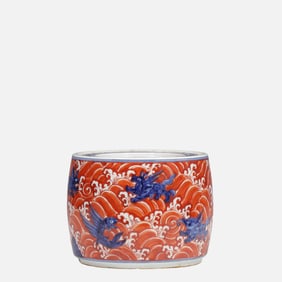 A blue and white alum and red sea beast pattern cricket jar from the Xuande period of the Ming