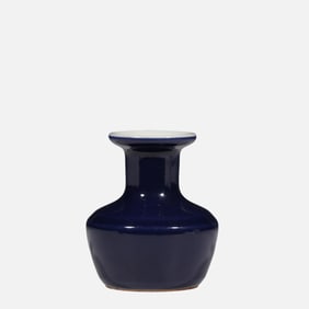 A Chinese Qing Dynasty Qianlong period blue-glazed plate-mouthed vase