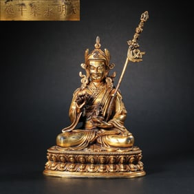 A Chinese gilt bronze statue of a seated Buddha from the Yongle period of the Ming Dynasty
