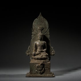 A 10th century Southeast Asian bronze statue of Buddha