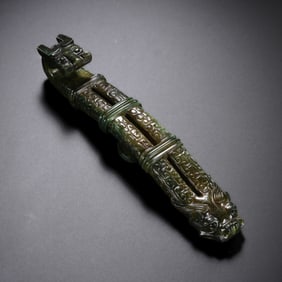 A Hetian jade belt hook with dragon head, circa 800 BC