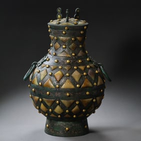 A rare complete bronze pot inlaid with gold and silver and Hetian jade, after 400 BC, Warring States