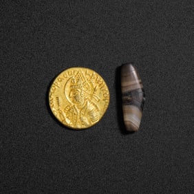 Pure gold coins and agate beads from the Kushan period, circa 1st century AD