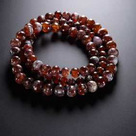 Agate beads inlaid with copper nails, Liao Dynasty, 10th century AD