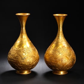 A pair of gilded vases with phoenix motifs from the Tang Dynasty, 8th century
