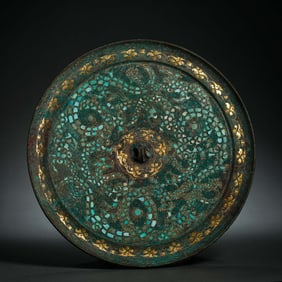 Bronze mirror inlaid with gemstones after 500 BC