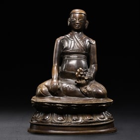 A Tibetan bronze statue of a seated Buddha from the 18th century or later