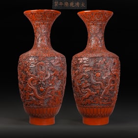 A pair of lacquer and red-carved vases from the Qianlong period of the Qing Dynasty