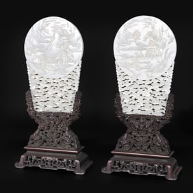 A pair of Hetian white jade screens with red sandalwood base and relief landscape and cloud