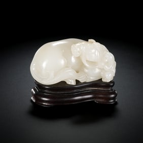 A 17th-18th century rosewood base inlaid with Hetian white jade and the Chinese character “Marquis
