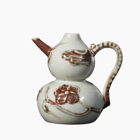 Yuan Dynasty underglaze red embossed floral gourd pot
