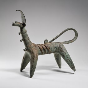 BRONZE FIGURE OF A HORNED ANIMAL FROM WESTERN ASIA, CIRCA 2000 AD