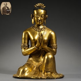 A GILT-BRONZE STATUE OF A SEATED VENERABLE FROM TIBET, 17TH CENTURY