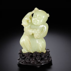 A CHINESE QING DYNASTY HETIAN YELLOW JADE CARVED CHILD ORNAMENT