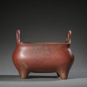 A CHINESE BRONZE STOVE WITH TWO HANDLES FROM THE XUANDE PERIOD OF THE MING DYNASTY