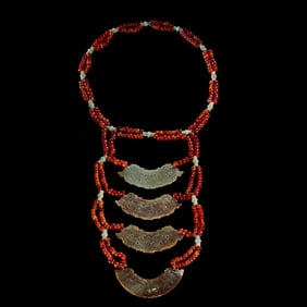 RED AGATE PENDANT SET FROM THE WESTERN ZHOU DYNASTY, CHINA, CIRCA 1000 BC