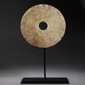 TADPOLE-PATTERNED HETIAN JADE BI FROM THE WARRING STATES PERIOD, CHINA