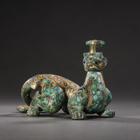 GOLD, SILVER AND TURQUOISE INLAID AUSPICIOUS BEAST FROM THE WARRING STATES PERIOD OF CHINA