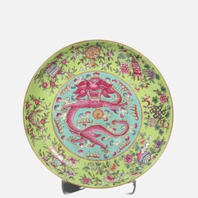 A CHINESE GREEN-GLAZED, POWDER-ENAMEL DRAGON-PATTERNED PLATE FROM THE DAOGUANG PERIOD OF THE QING