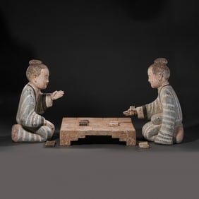 A GROUP OF CHINESE HAN DYNASTY PAINTED POTTERY FIGURES PLAYING CHESS