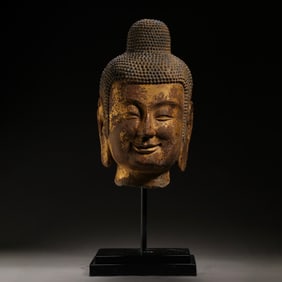 ANCIENT CHINESE BLUESTONE AND GOLD-GILDED BUDDHA HEAD