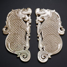 A PAIR OF JADE PENDANTS WITH AUSPICIOUS BEASTS FROM THE HAN DYNASTY, CHINA