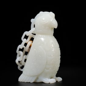 A CHINESE WESTERN ZHOU DYNASTY HETIAN WHITE JADE OWL-SHAPED VASE WITH A CHAIN LID