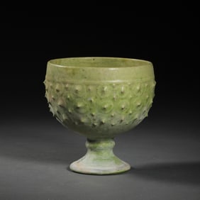 CHINESE SUI DYNASTY GREEN-GLAZED DRUM-SHAPED HIGH-FOOTED CUP