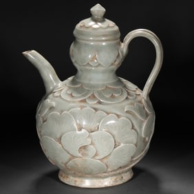 A YAOZHOU CELADON-GLAZED EWER WITH CARVED LOTUS PETALS, LATE TANG AND FIVE DYNASTIES PERIOD, CHINA