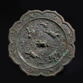 A CHINESE WARRING STATES PERIOD DIAMOND-SHAPED BRONZE MIRROR