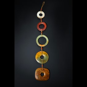 A set of Hetian white jade and agate pendants from the Warring States period of China, dating from