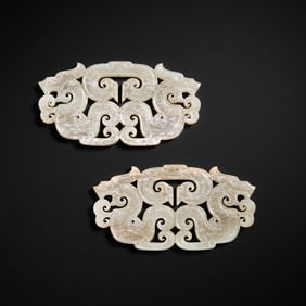 Jade disc with double dragon design from Hetian white jade, dating from the Warring States period of