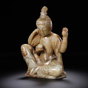 Seated Guanyin statue made of Hetian jade from the Song Dynasty in China, dating from the 11th to