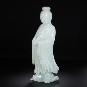 Standing Guanyin statue made of Hetian white jade from the Qing Dynasty, 19th century.