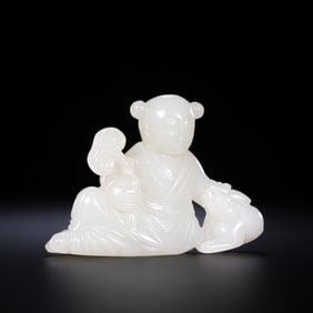 A 17th-century Hetian white jade boy figurine from the Qing Dynasty in China.