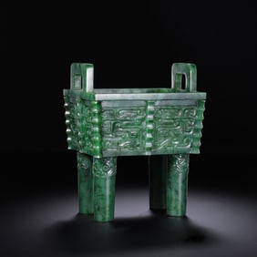 An 18th-century Chinese Qing Dynasty Hetian jade bronze tripod with an antique animal pattern bears
