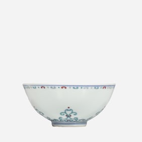 An 18th-century Chinese Qing Dynasty doucai (enamel overglaze) bowl with a scrolling floral design