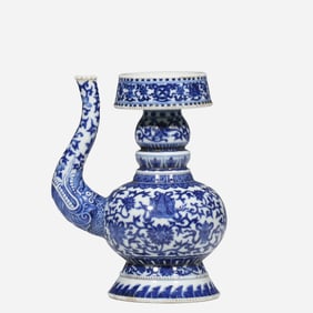 An 18th-century Chinese blue and white porcelain vase with a scrolling floral design, bearing the