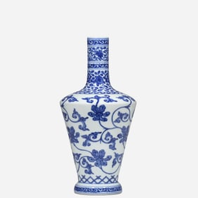 An 18th-century Chinese blue and white porcelain vase with a scrolling floral design, bearing the