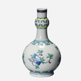 An 18th-century Chinese Qing Dynasty doucai (enamel overglaze enamel) vase with a peach design and a