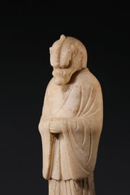 White marble dragon-headed human figure from the Tang Dynasty, 6th-7th century AD.
