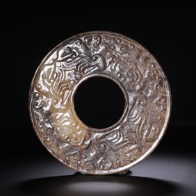 Jade disc with dragon design from Hetian white jade, Han Dynasty, 1st-2nd century AD.