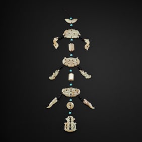 Jade pendants from the Warring States period in China, dating back to the 2nd century BC or later.