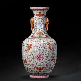 An 18th-century Chinese polychrome vase with elephant-ear handles and a scrolling floral design,