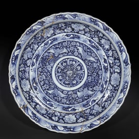 A large blue-and-white porcelain plate with phoenix design from the Ming Dynasty (15th century) in