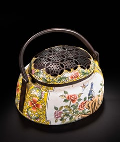 A copper-bodied enamel-painted hand warmer from the Qing Dynasty of the 18th century, bearing the
