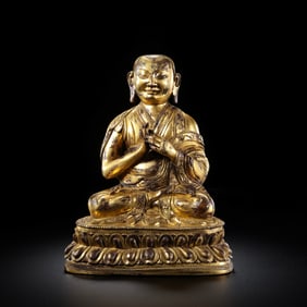 Gilt bronze seated Guru Buddha statue from Tibet, 16th-17th century.